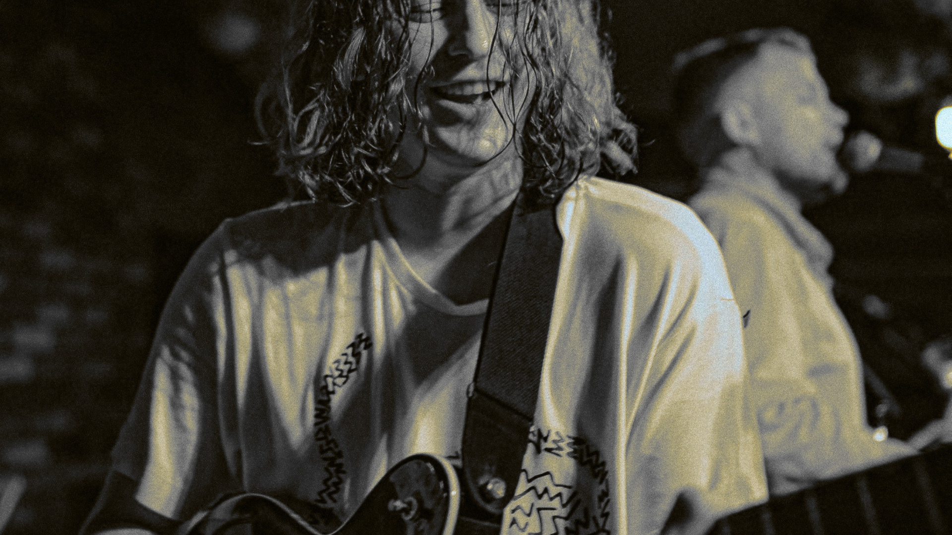 Musician playing guitar at event